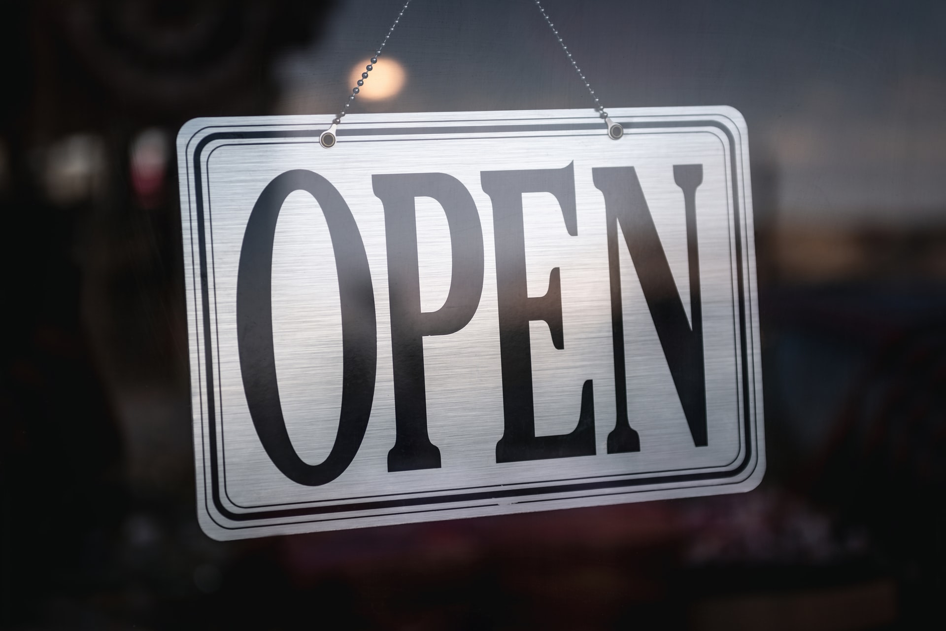 Business sign that reads "open"