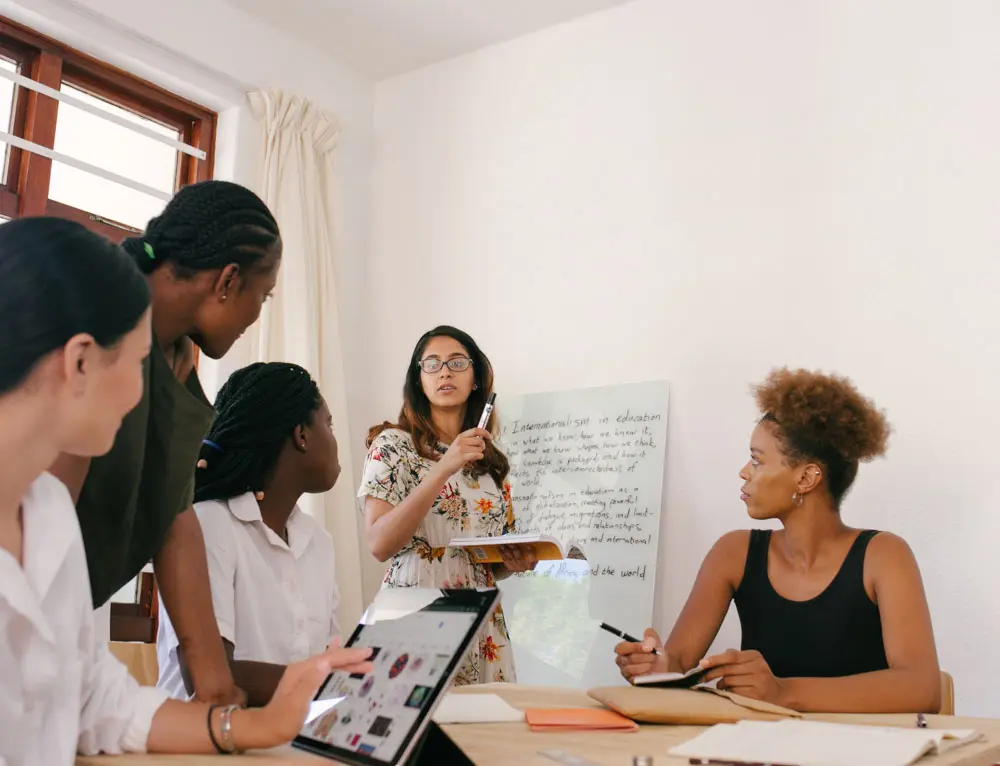 Marketing managers collaborate in an office setting.