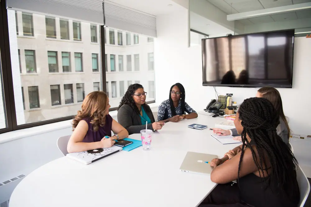 A design agency in Chicago strategizes on user experience design at a conference table.