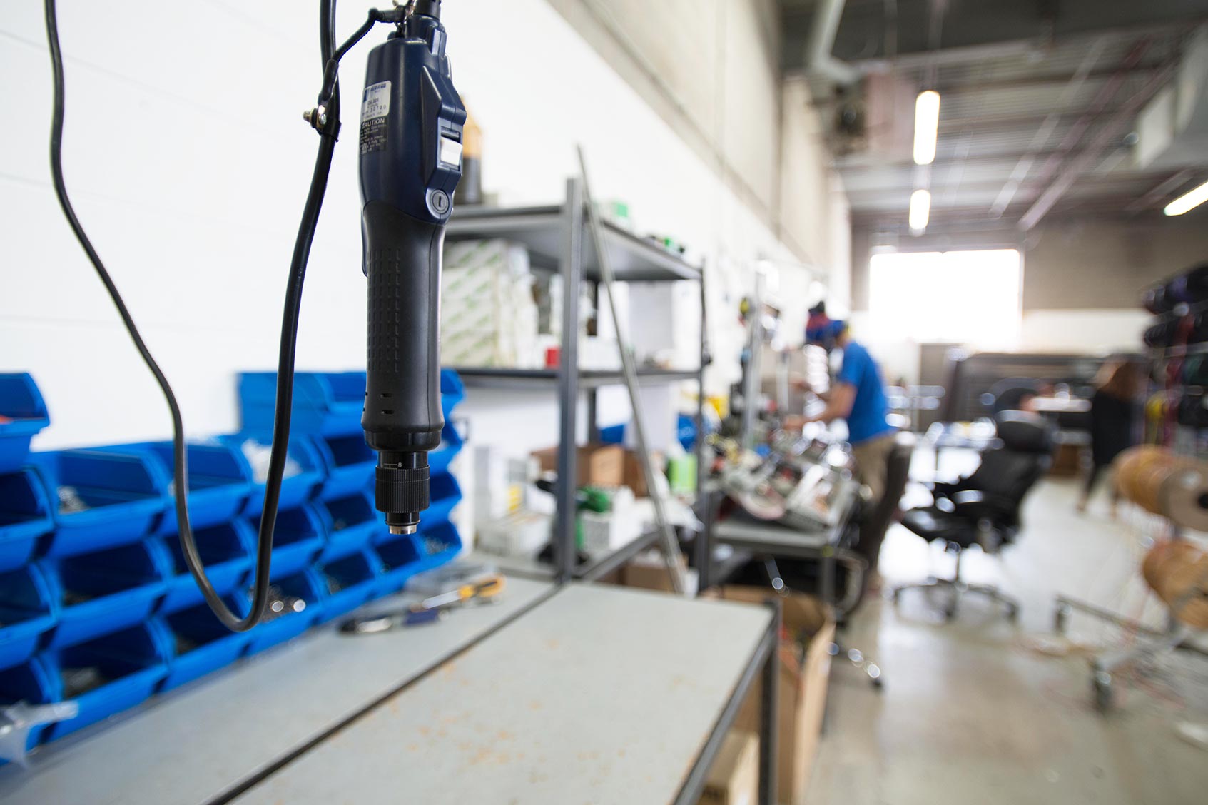 A person working with a machine.