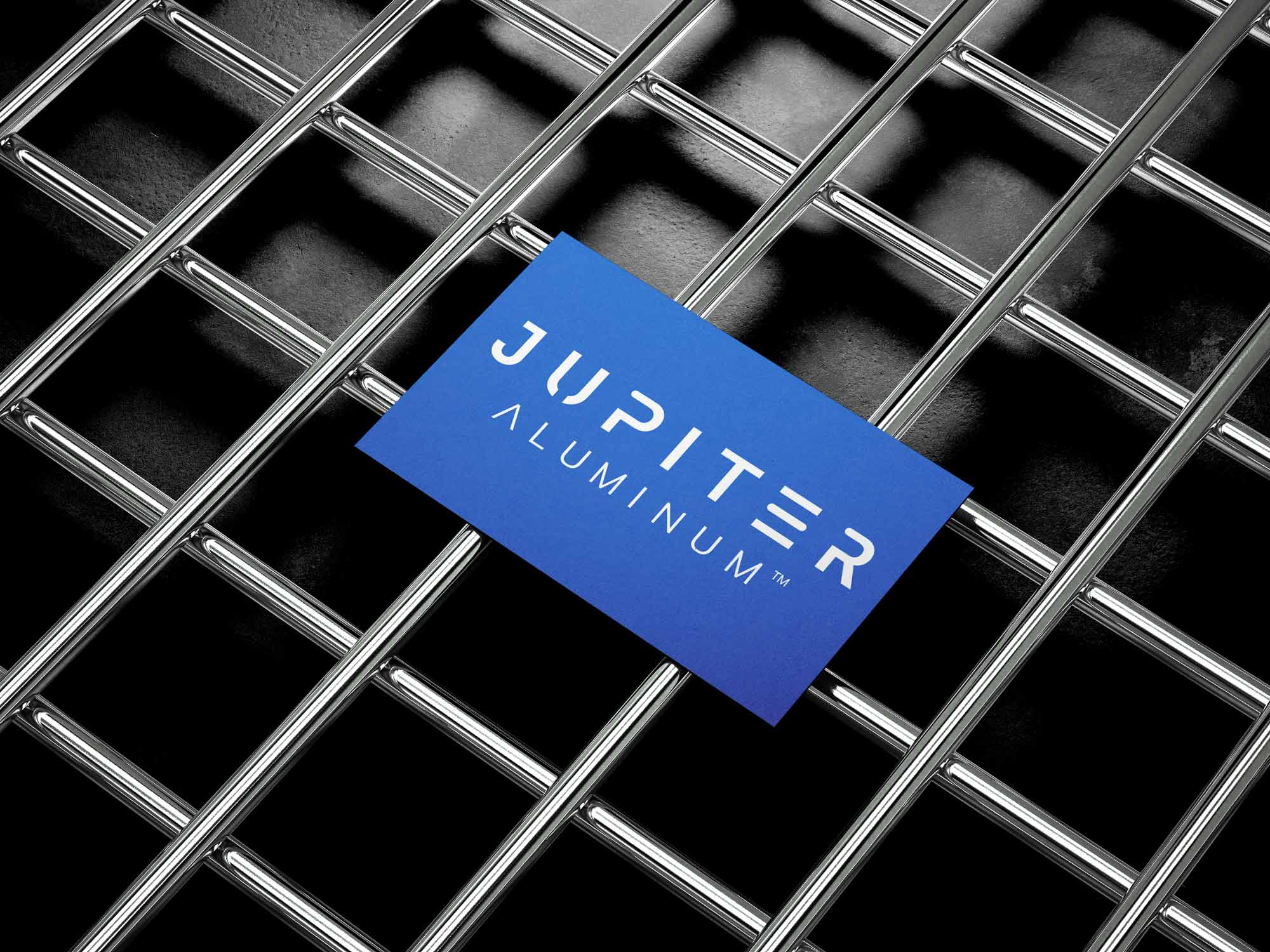 A client's logo on a blue business card on top of a metal structure.