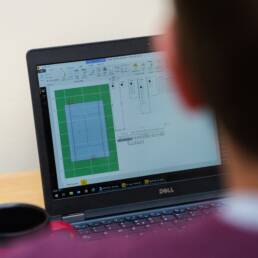 A person on a laptop creates user-centric design.
