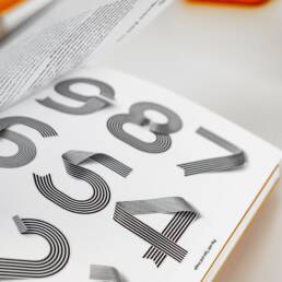 Graphic design of numbers in a design book.