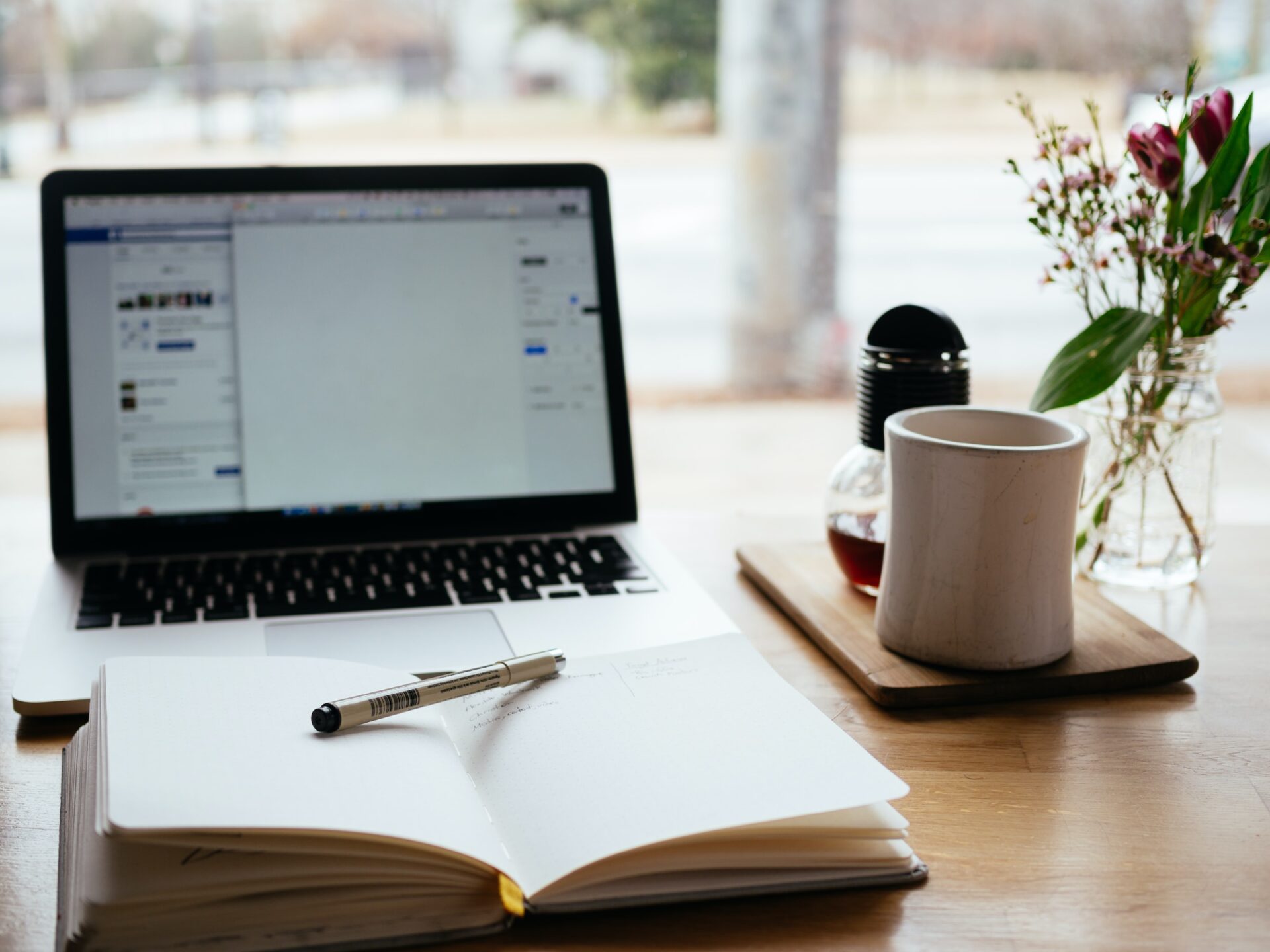 notebook, mug and computer