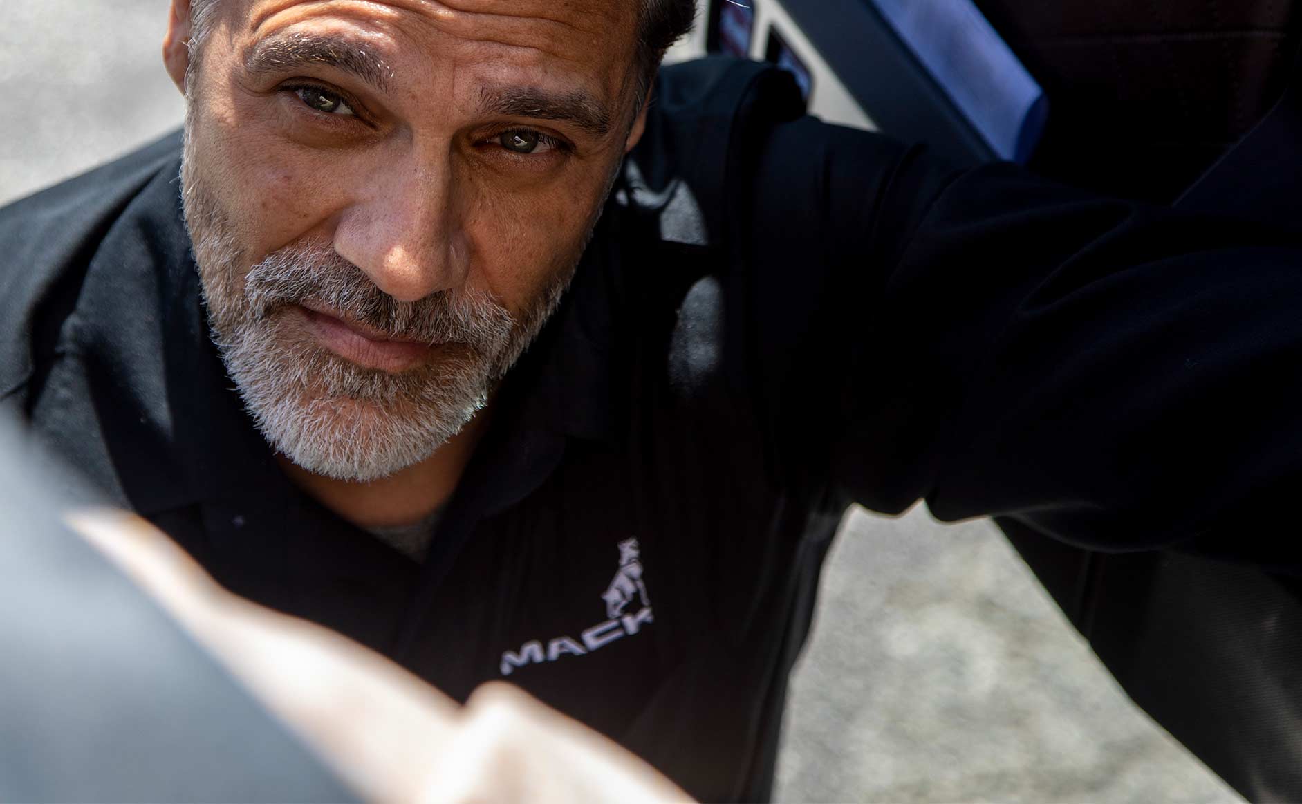 A person looks through the door of a semi-truck.