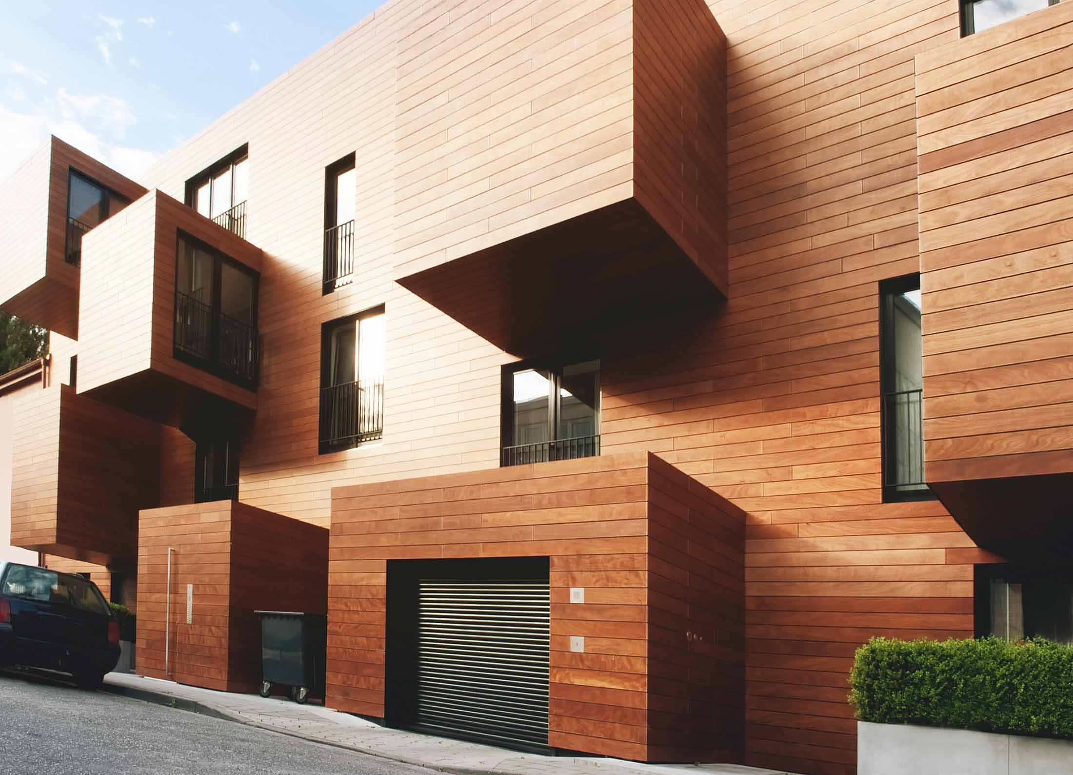 A wooden and modern design for an apartment building.