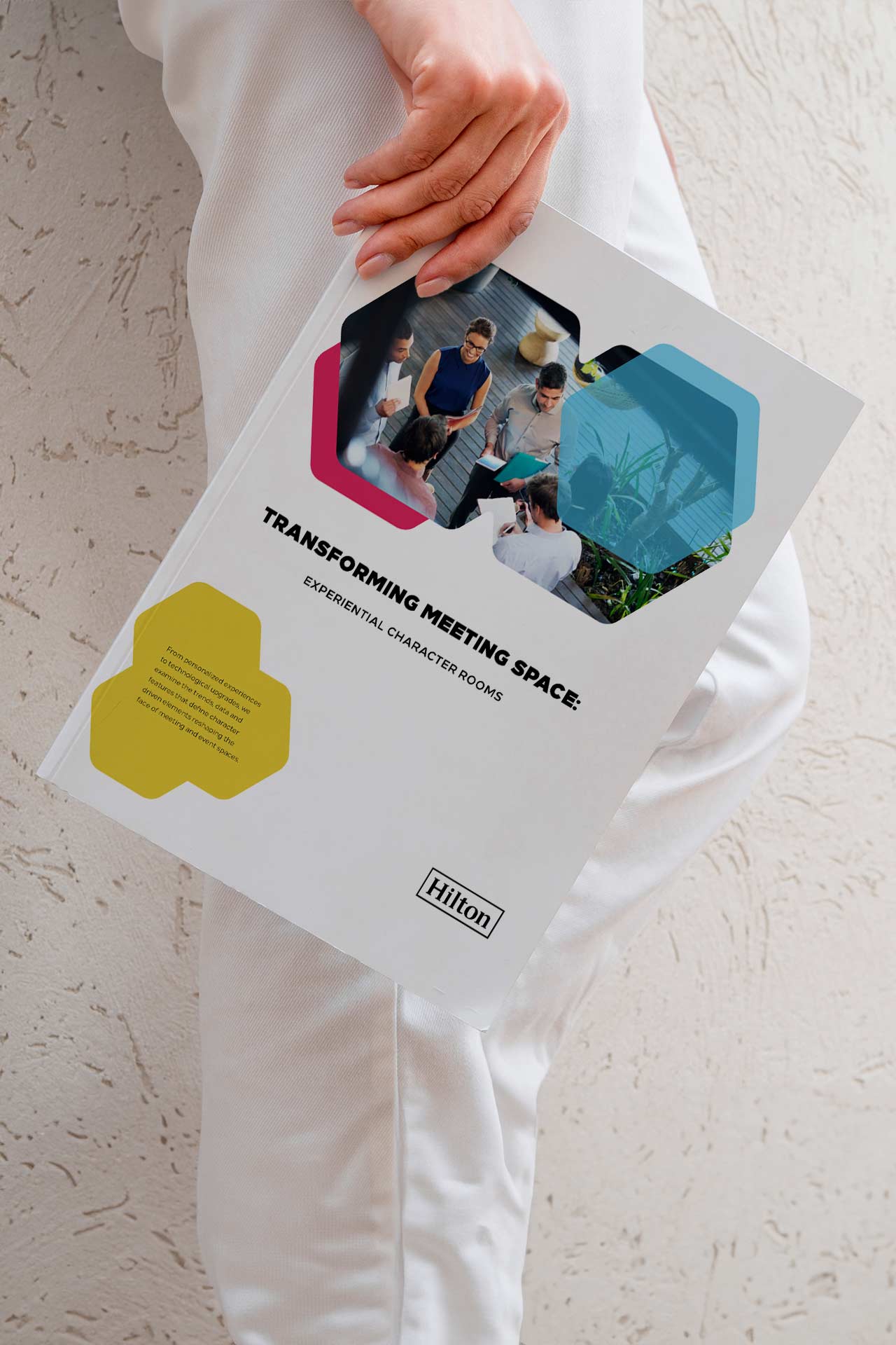 Person Holding Report Design Cover.