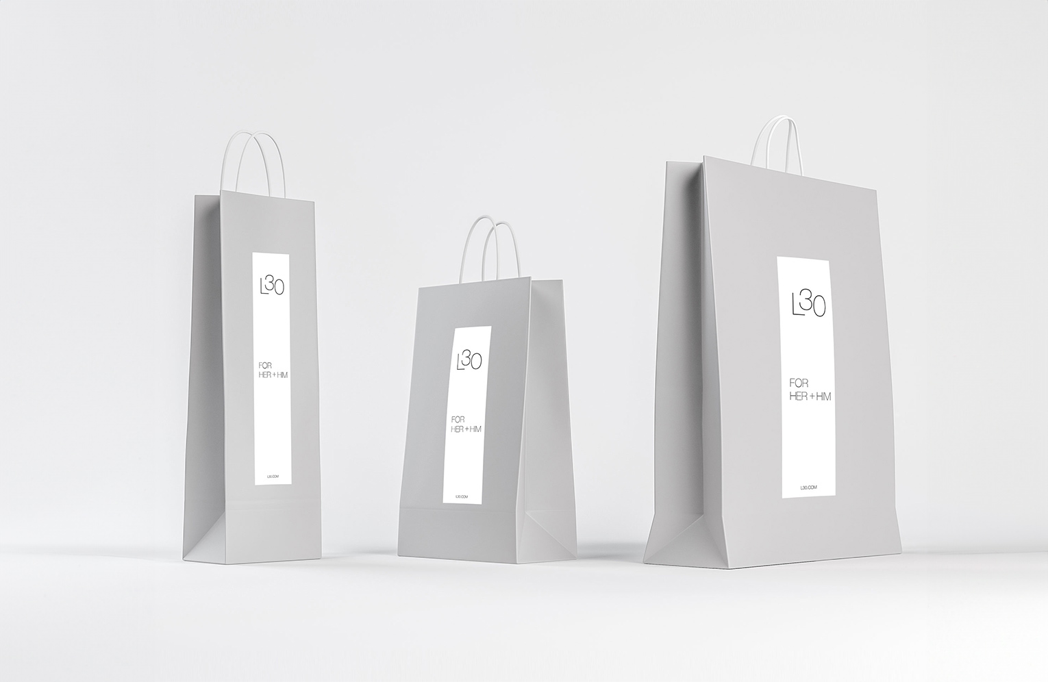 Set of luxury white paper bags for cosmetic company.