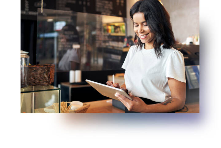 A person holding a tablet.