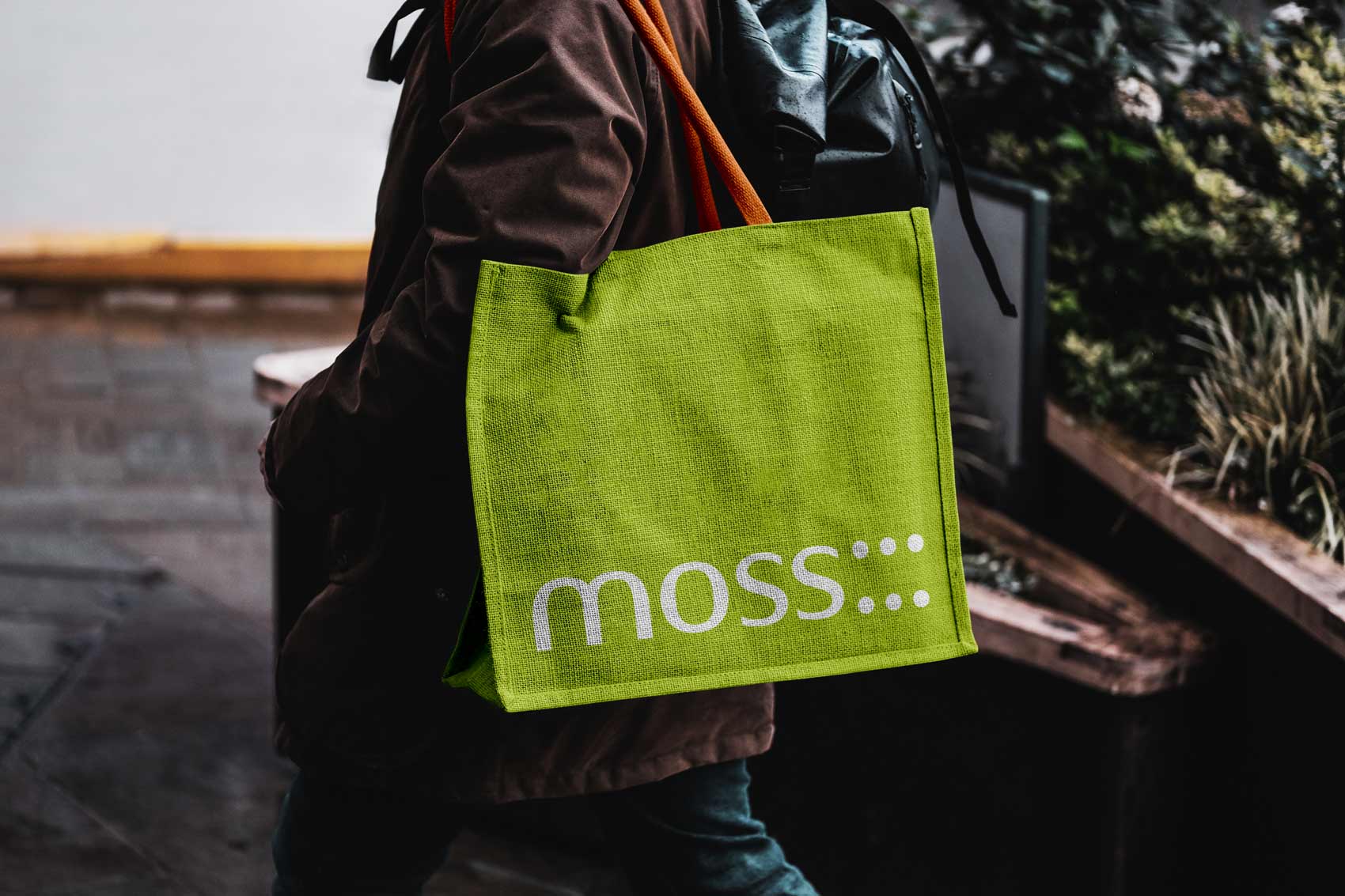 Logo for an architecture company on a lime green tote bag.