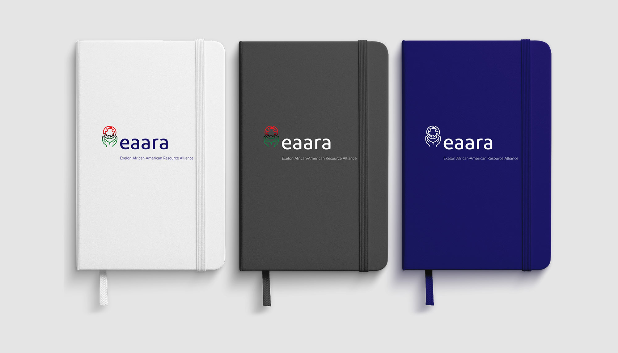 Branding—three different colored notebooks with the same logo on them.