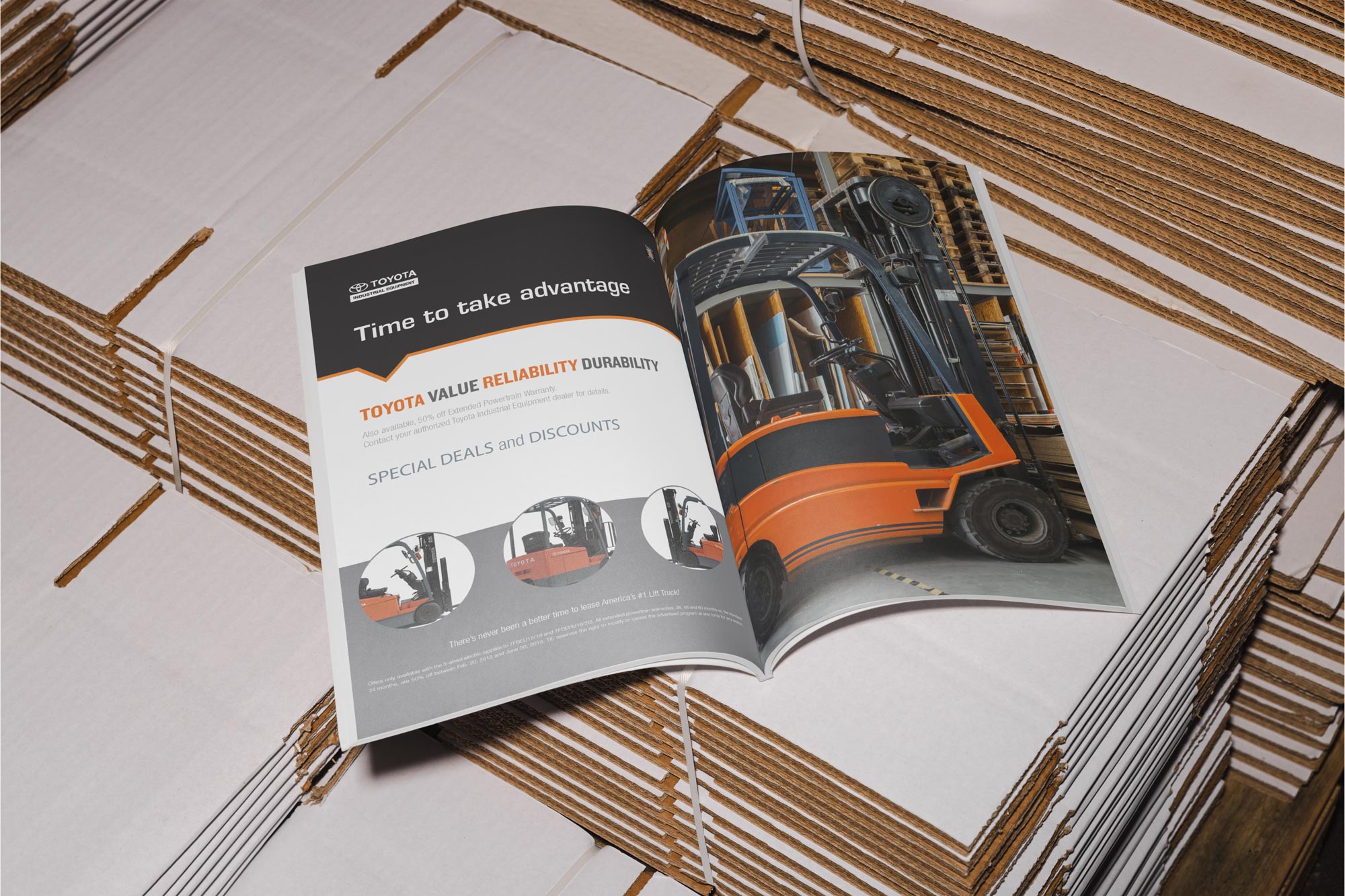 A magazine layout of a forklift driving manual on top of cardboard boxes.