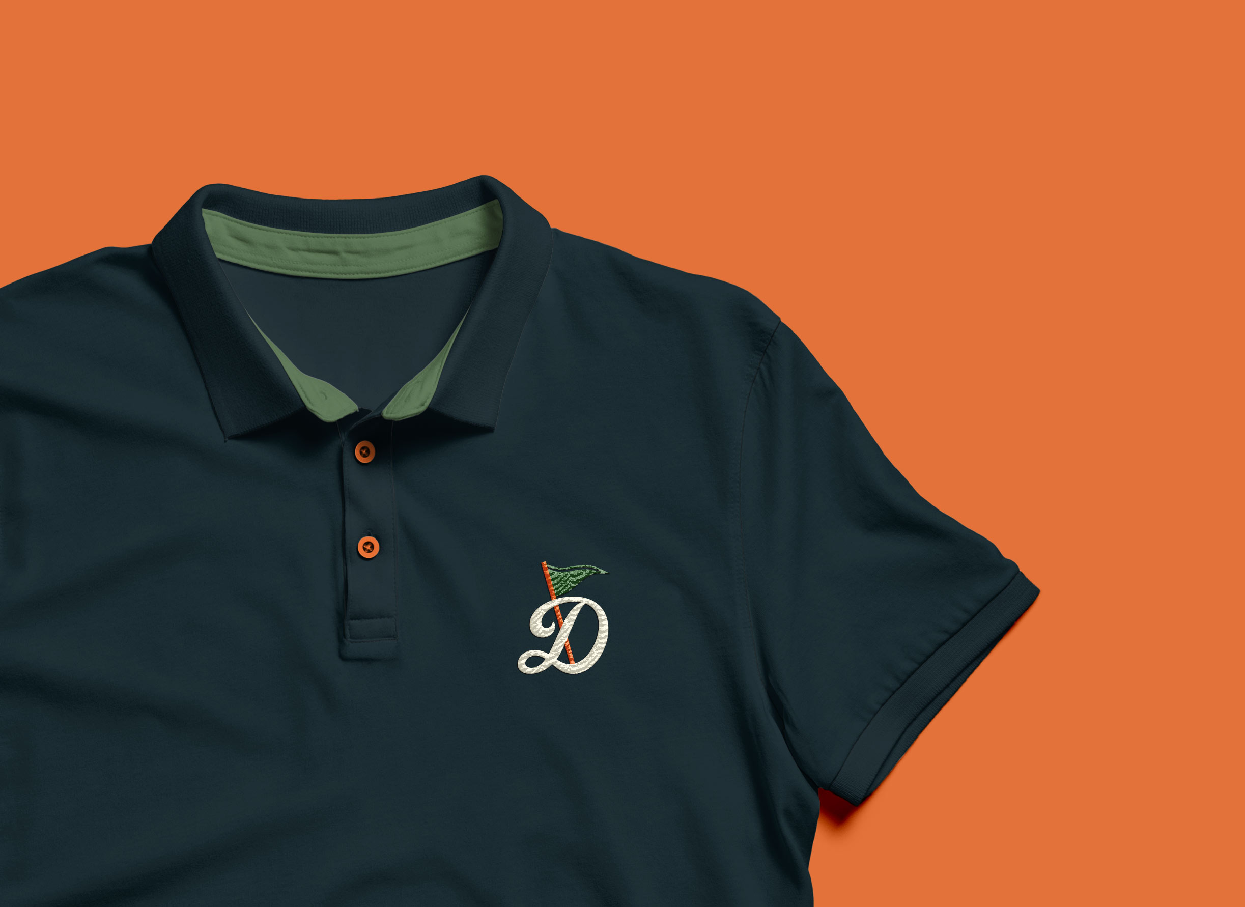 A golf polo shirt displaying a monogram logo design.