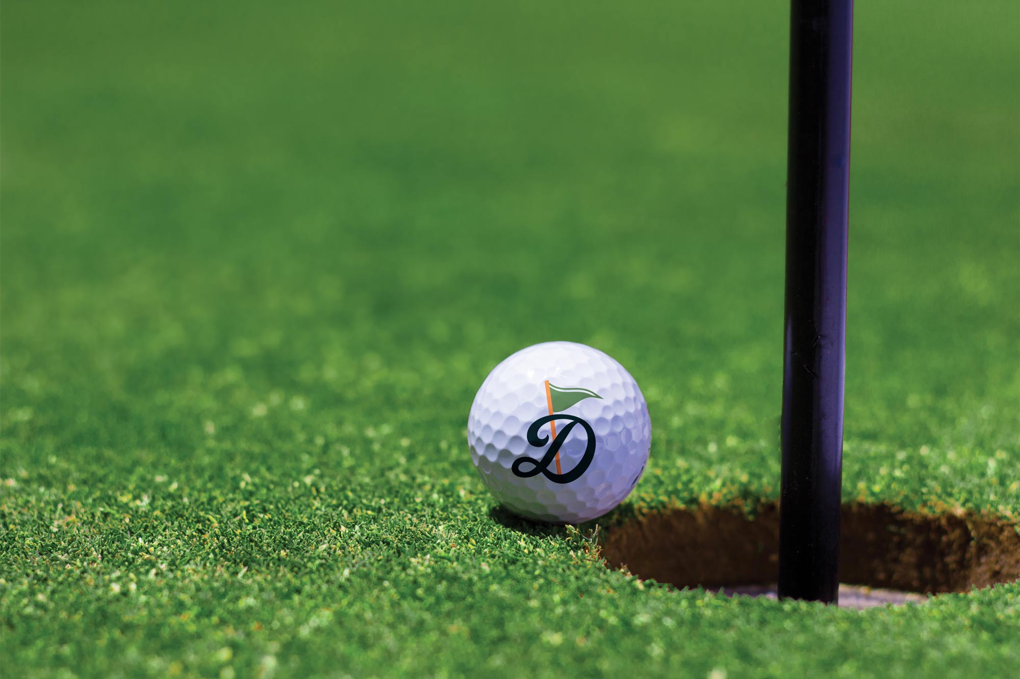 A golf ball featuring the client's logo.