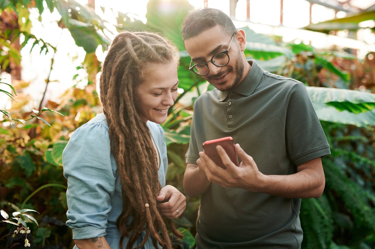 Two people navigating a mobile user interface. 