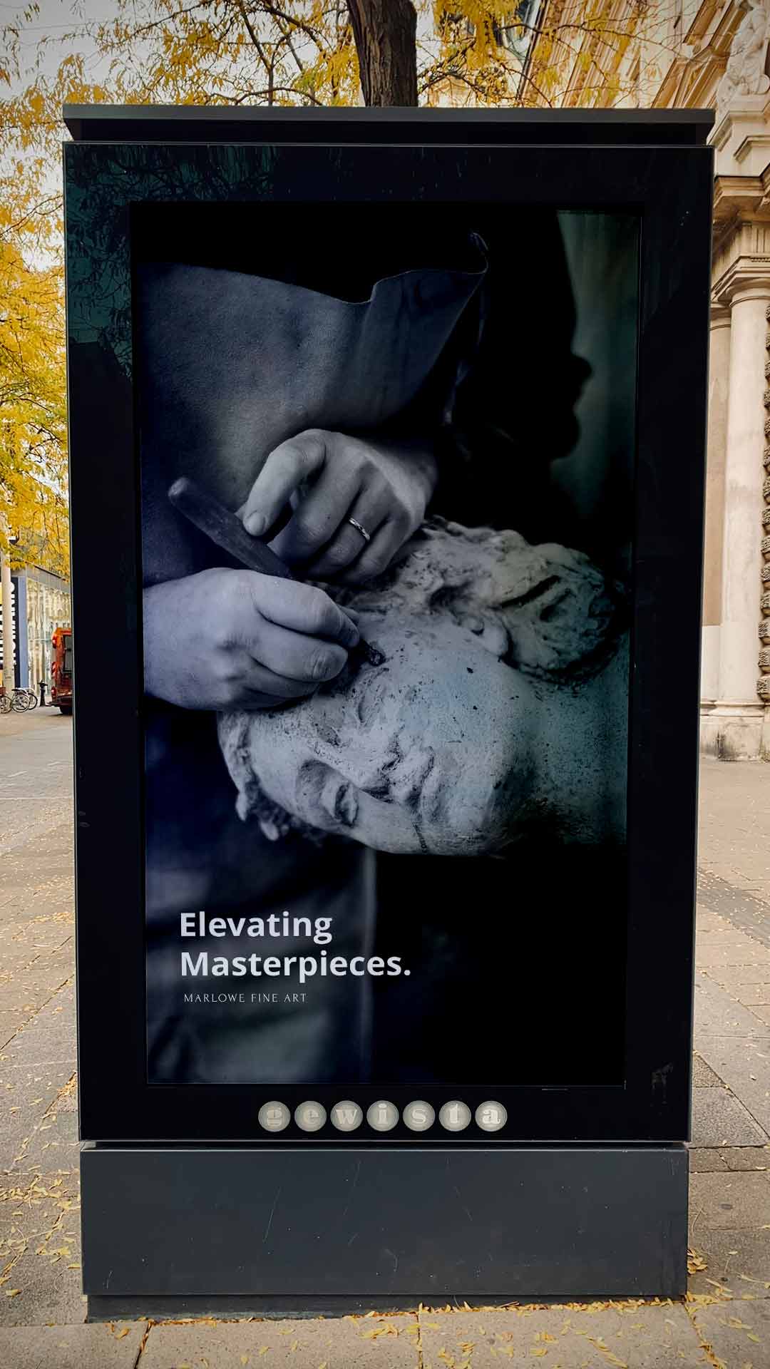 A street sign ad with a person creating a three-dimensional fine art sculpture.