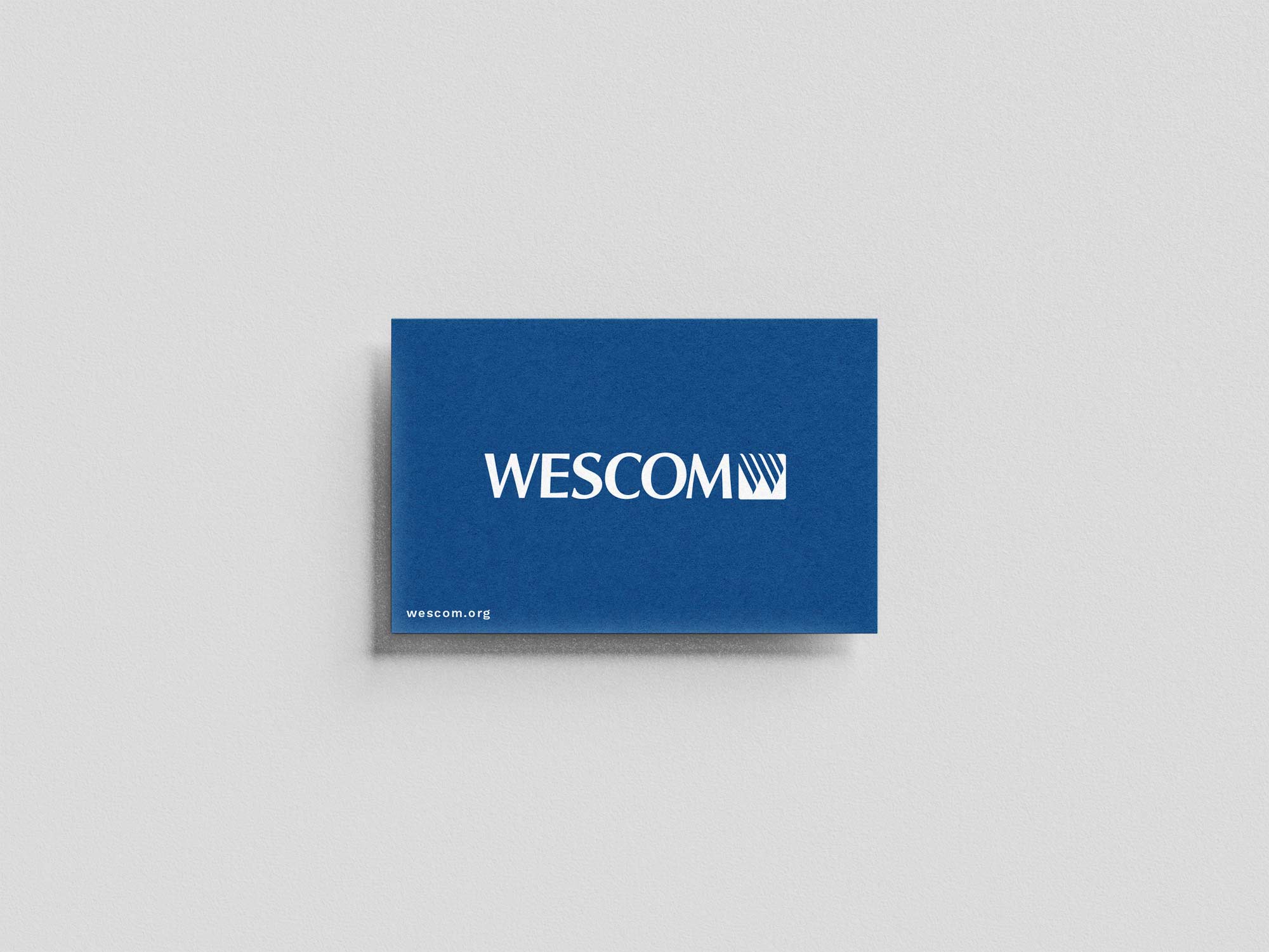 A blue business card for a bank with a logo on it.