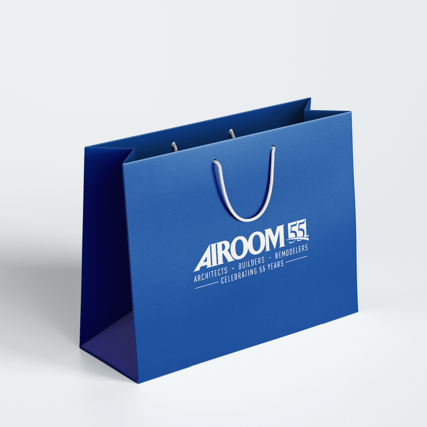 A blue gift bag with an anniversary logo.