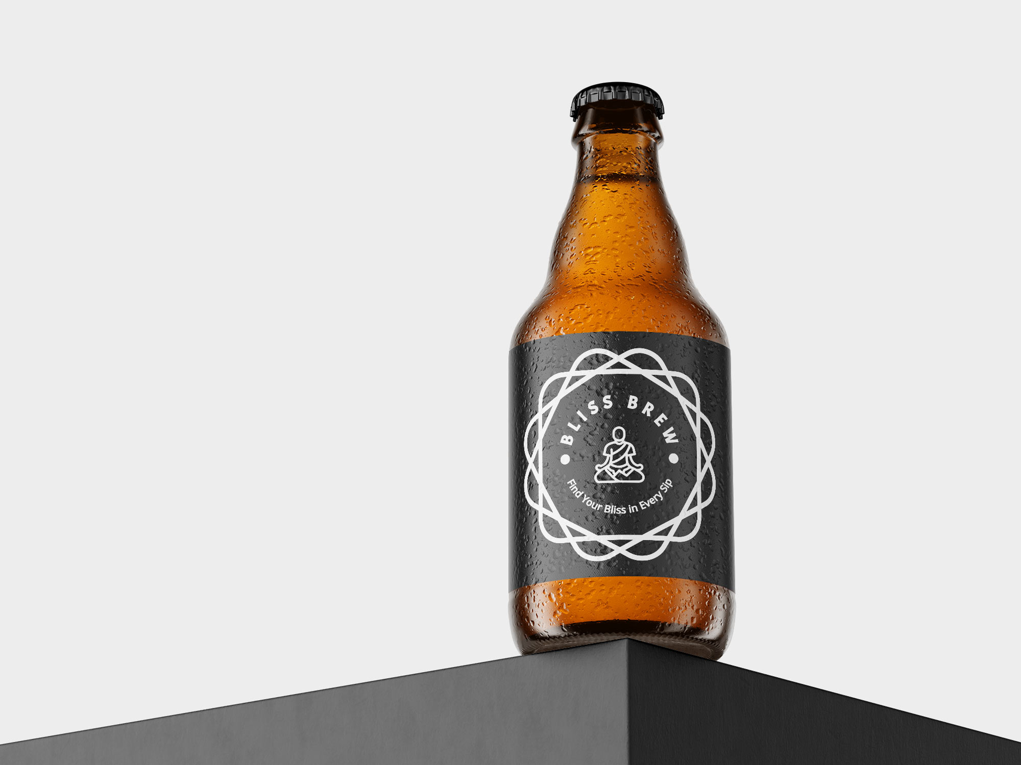 A beer bottle with a logo on it sitting on a black cube.