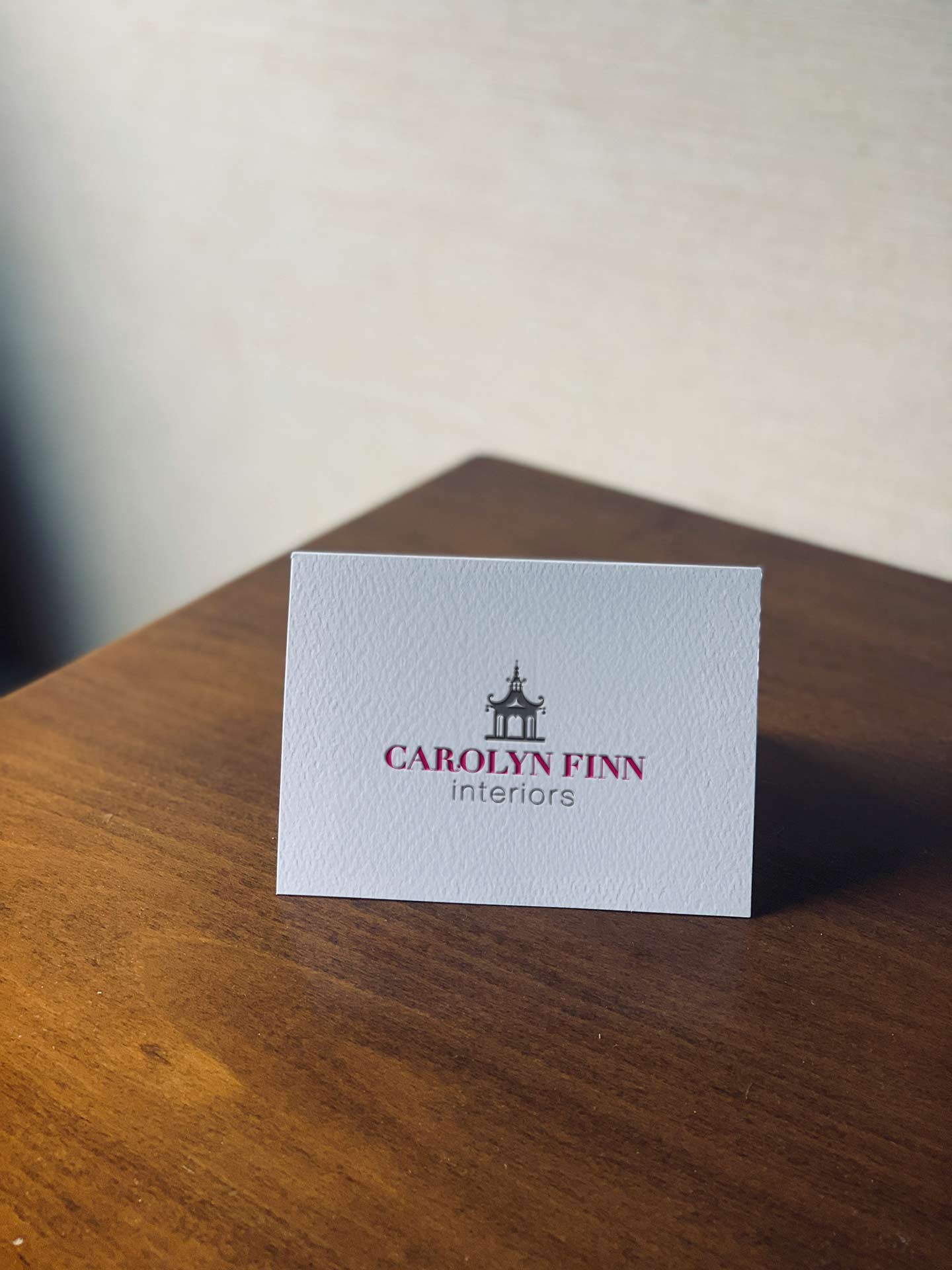 The front side of a business card featuring the client's logo.
