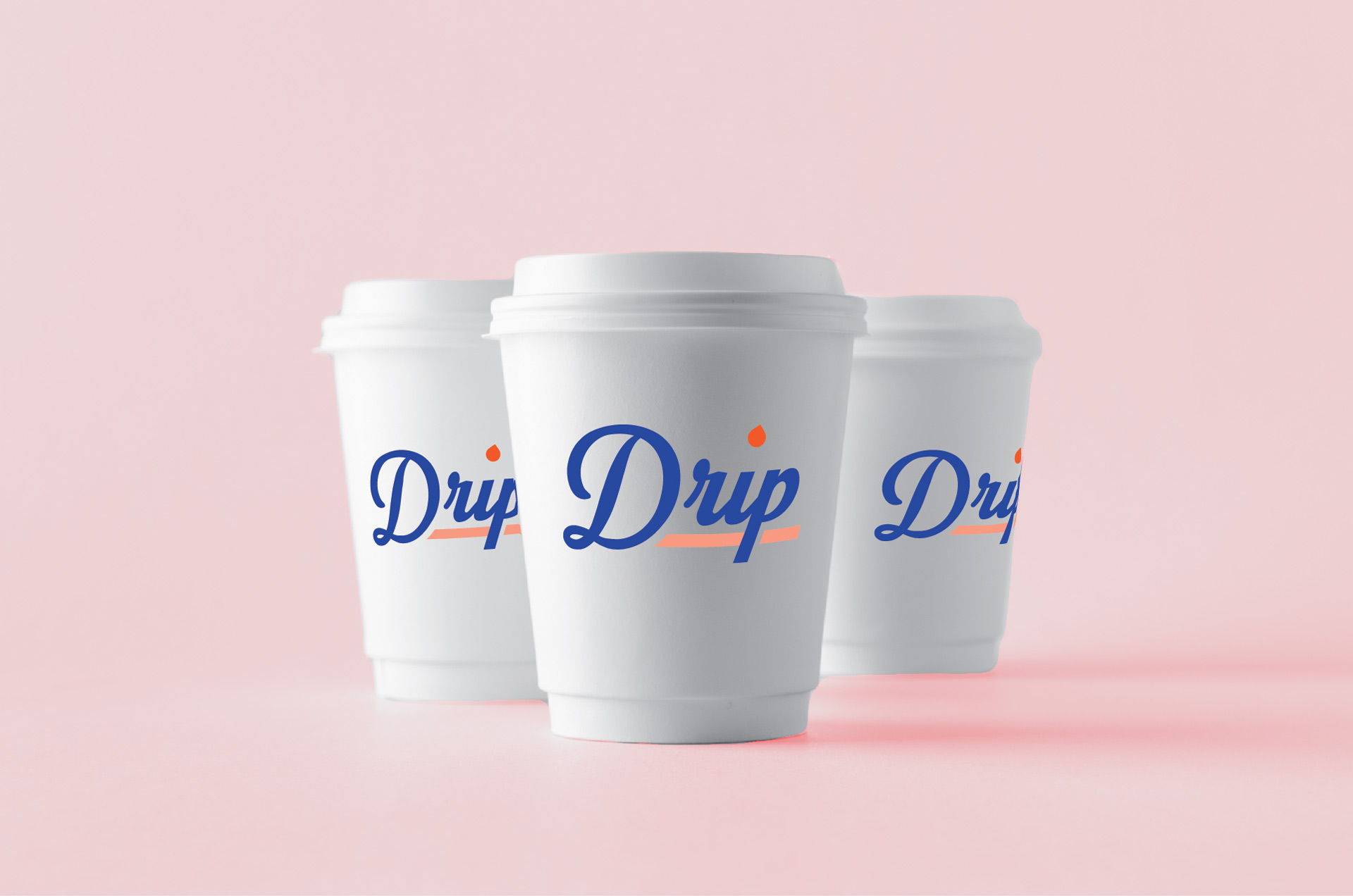 Three coffee cups with client's logo superimposed on them.