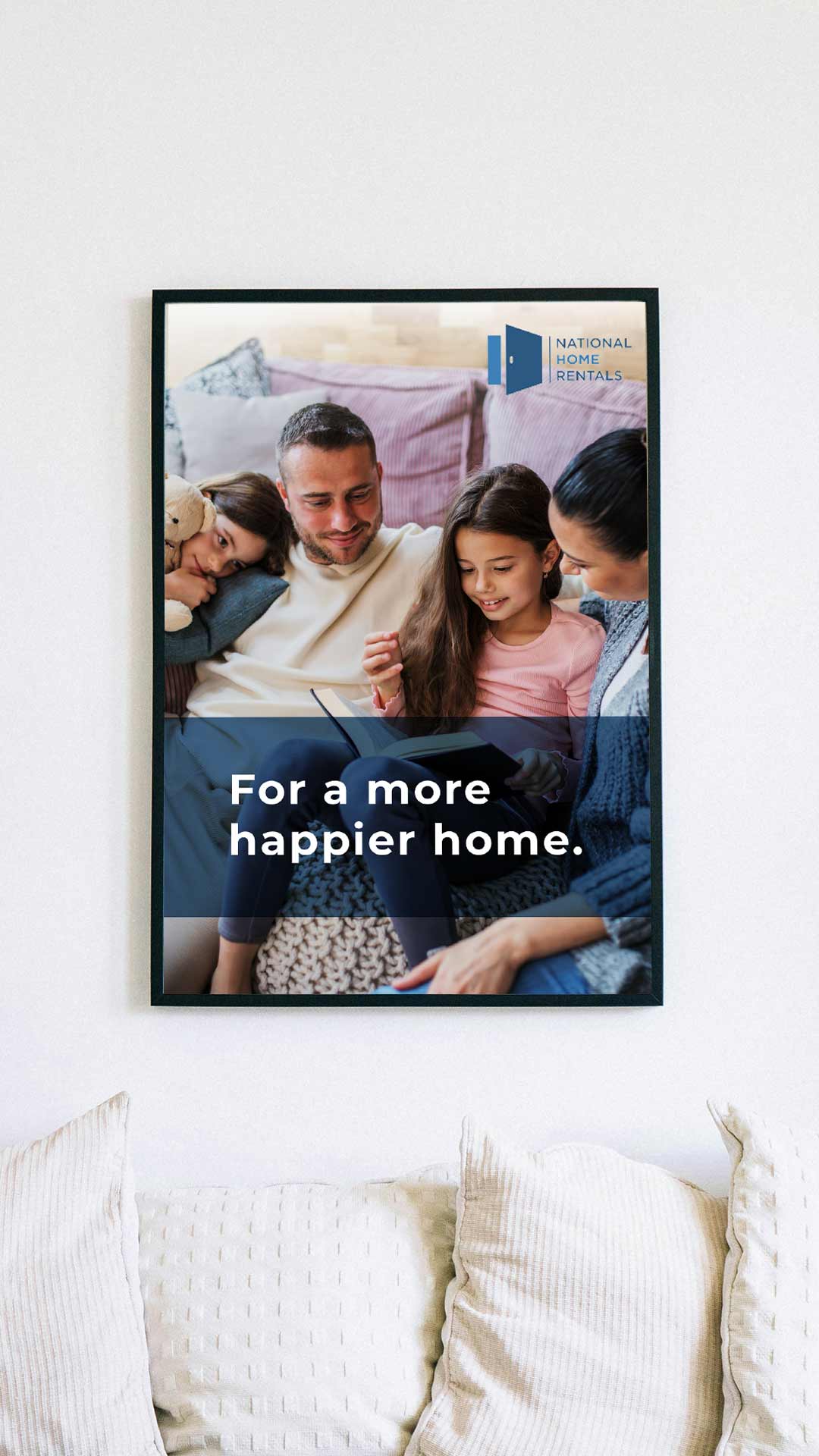 A family of four pictured in a frame on a wall with text that reads "For a more happier home".