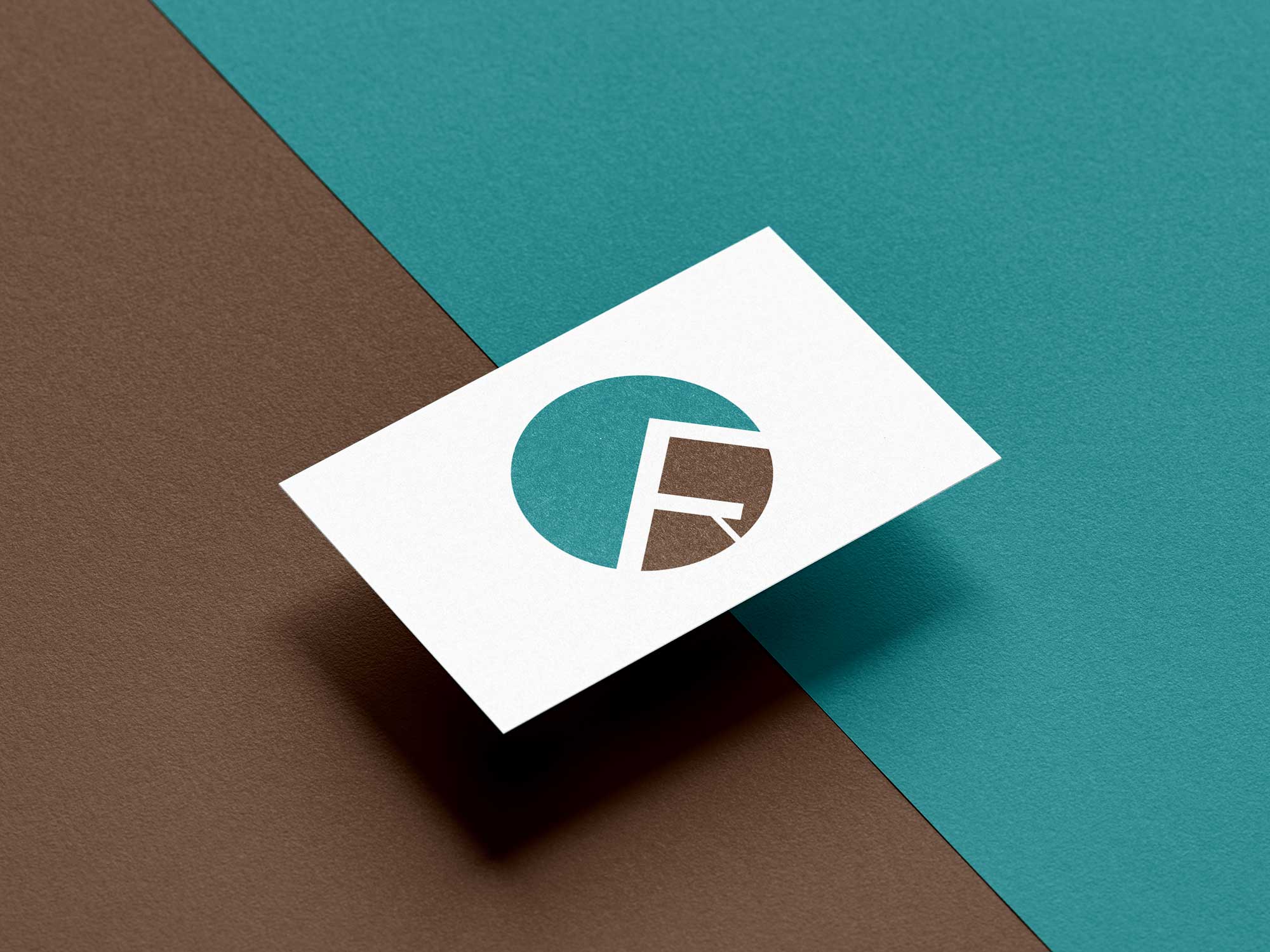 A business card with a company logo in the center of the card.