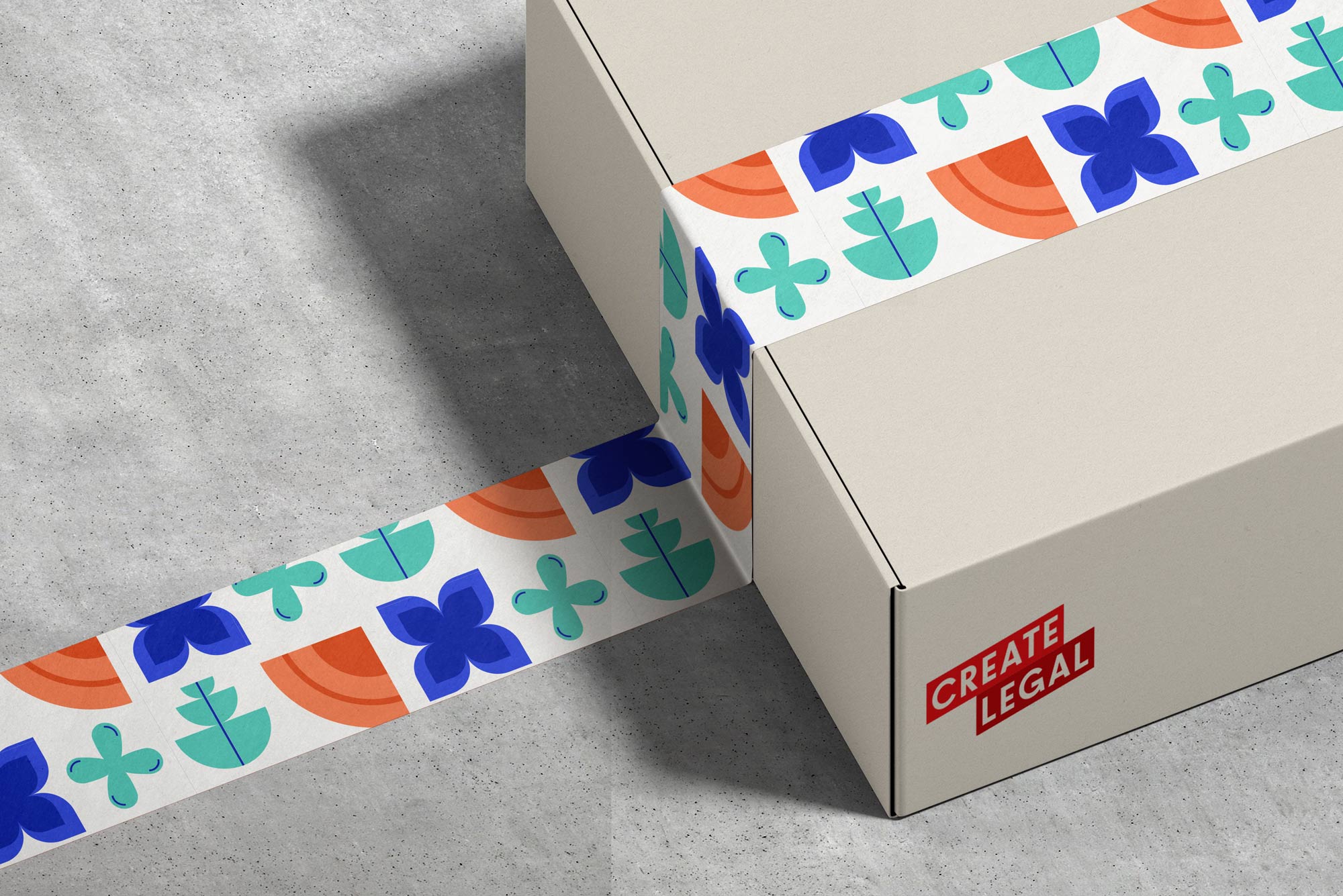 A legal company-branded cardboard box with patterned tape on it.