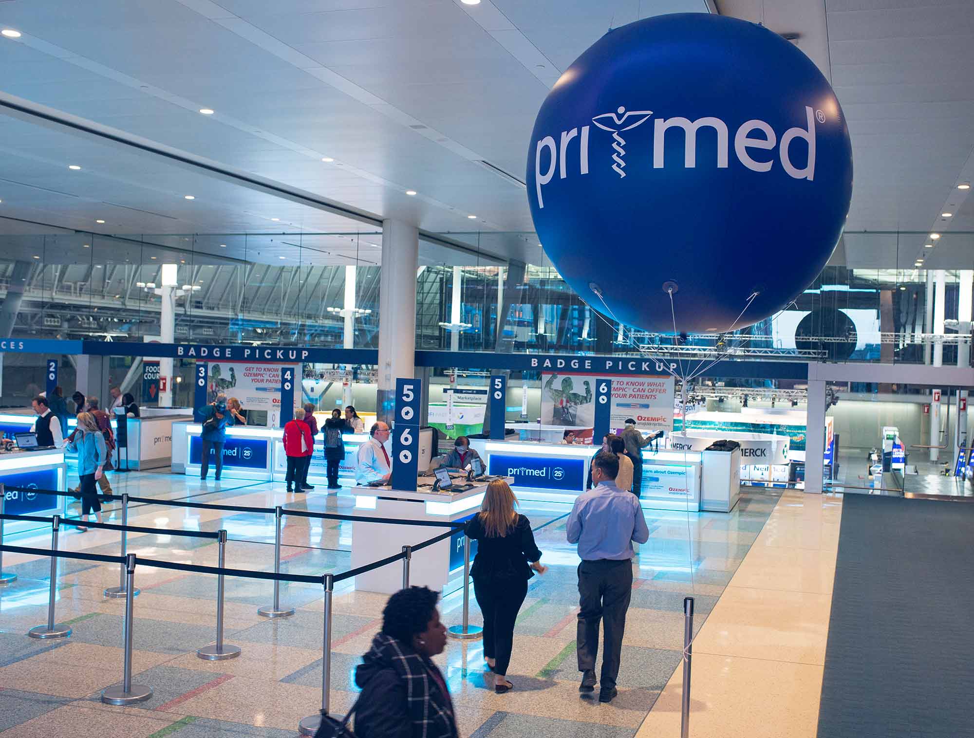 A large blue balloon with a logo on it—event marketing design.