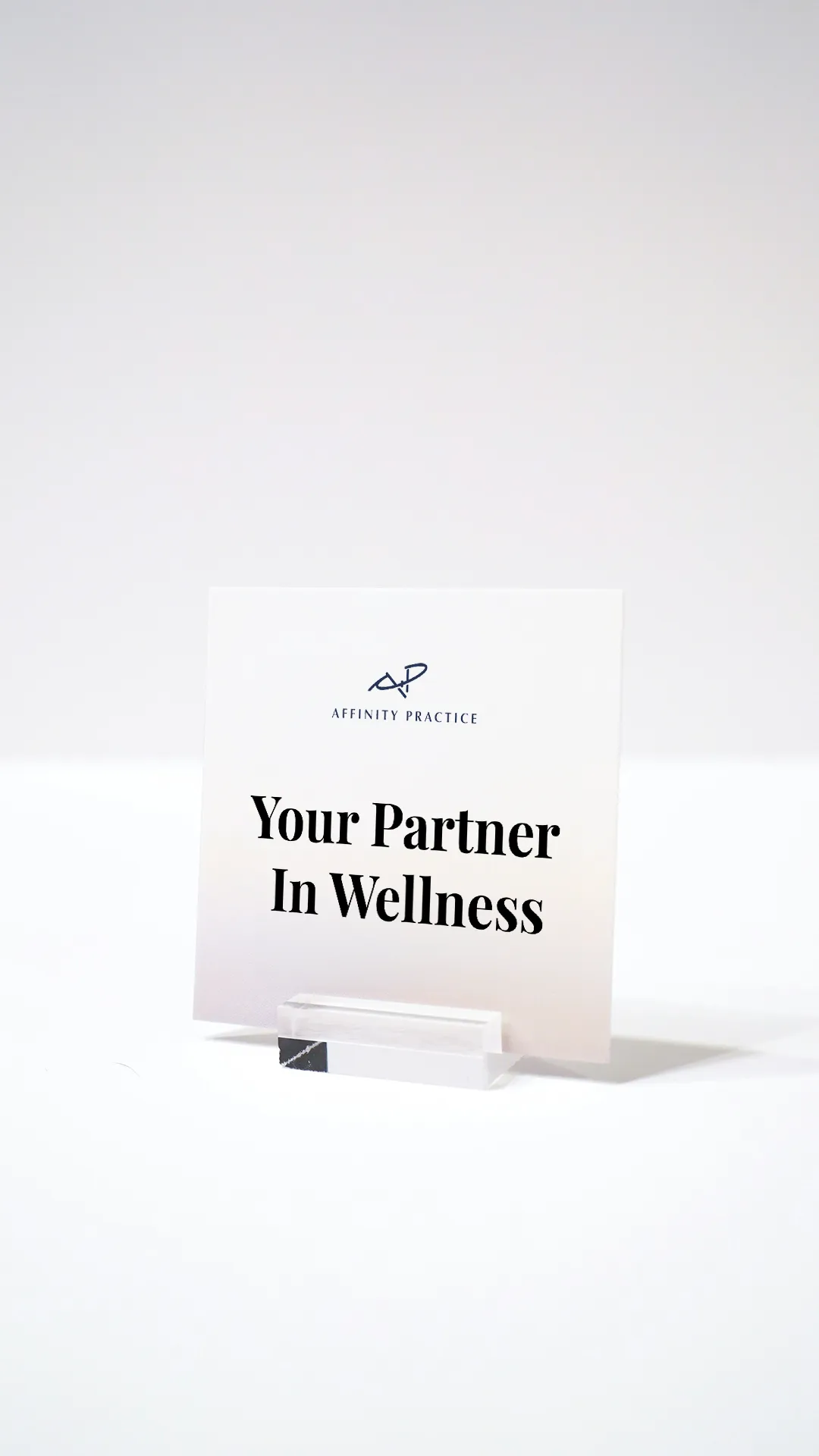 A card that reads "Your Partner in Wellness".