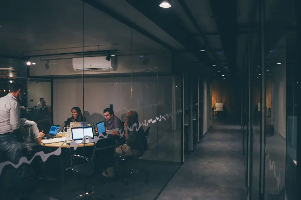 A design agency collaborating in a conference room for brand strategy.