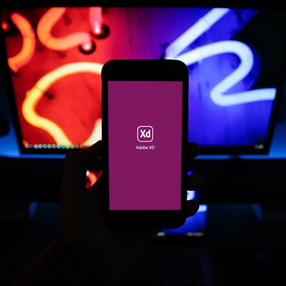 Adobe XD mobile app displayed on screen.