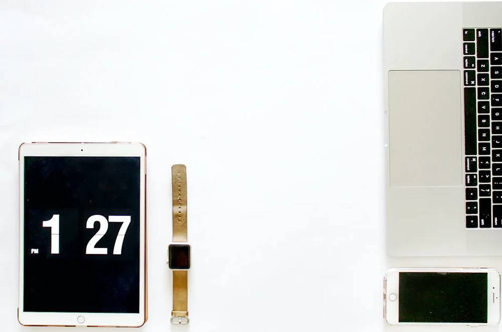 Digital devices on a clean white background.