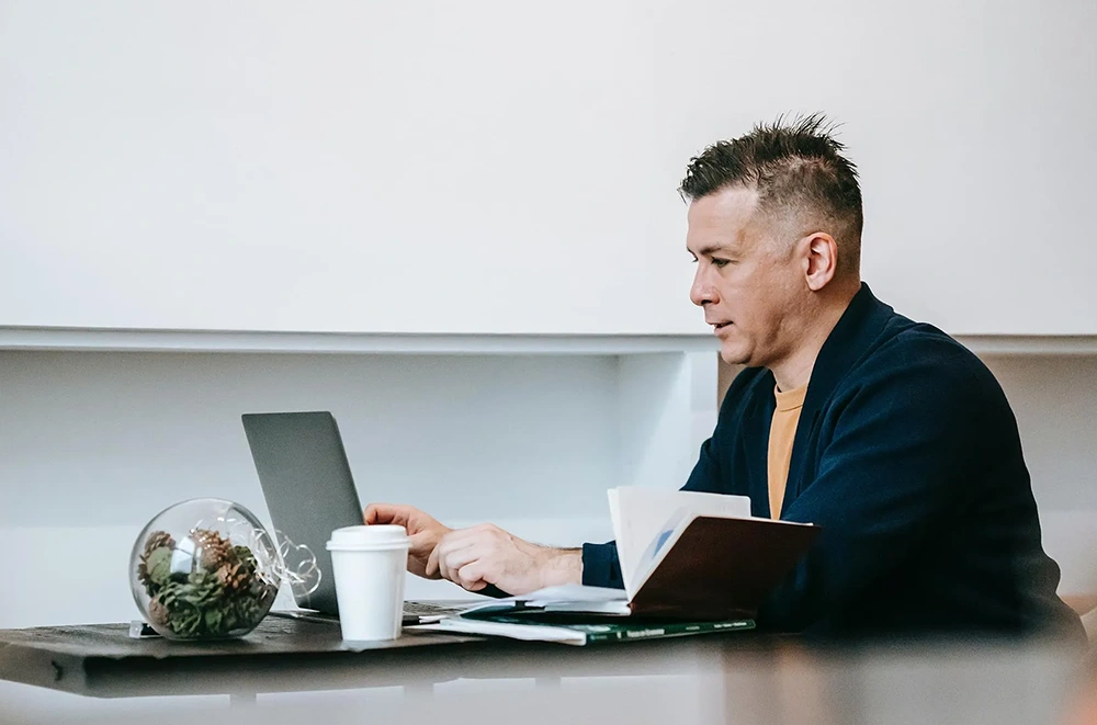 An office worker working on their laptop.