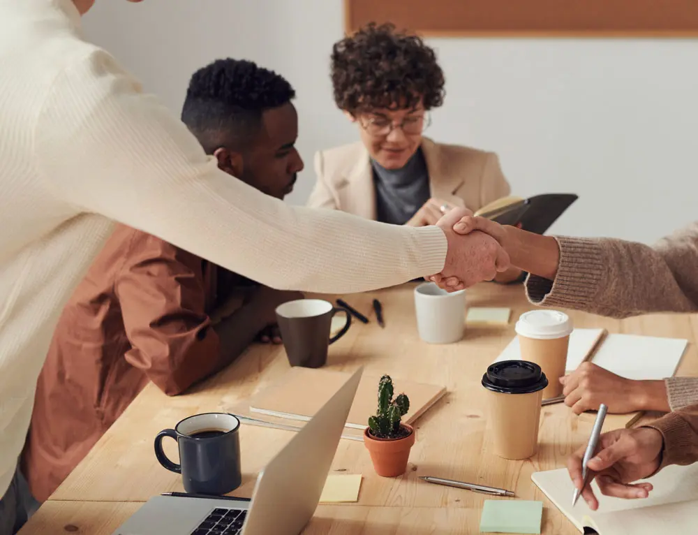 People collaborate in an office setting.