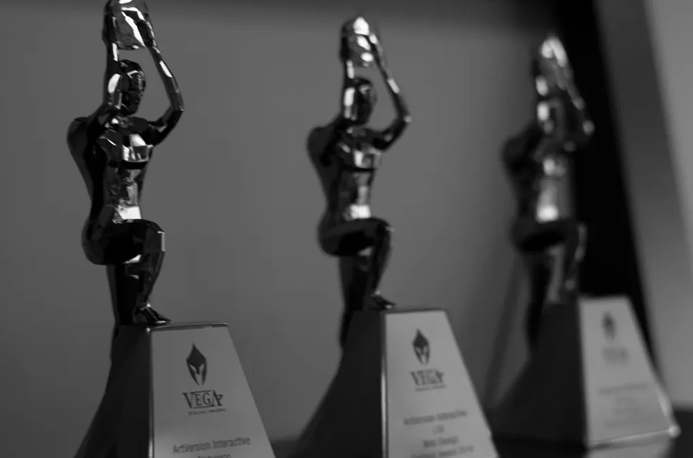 Three vega awards displayed on a shelf.