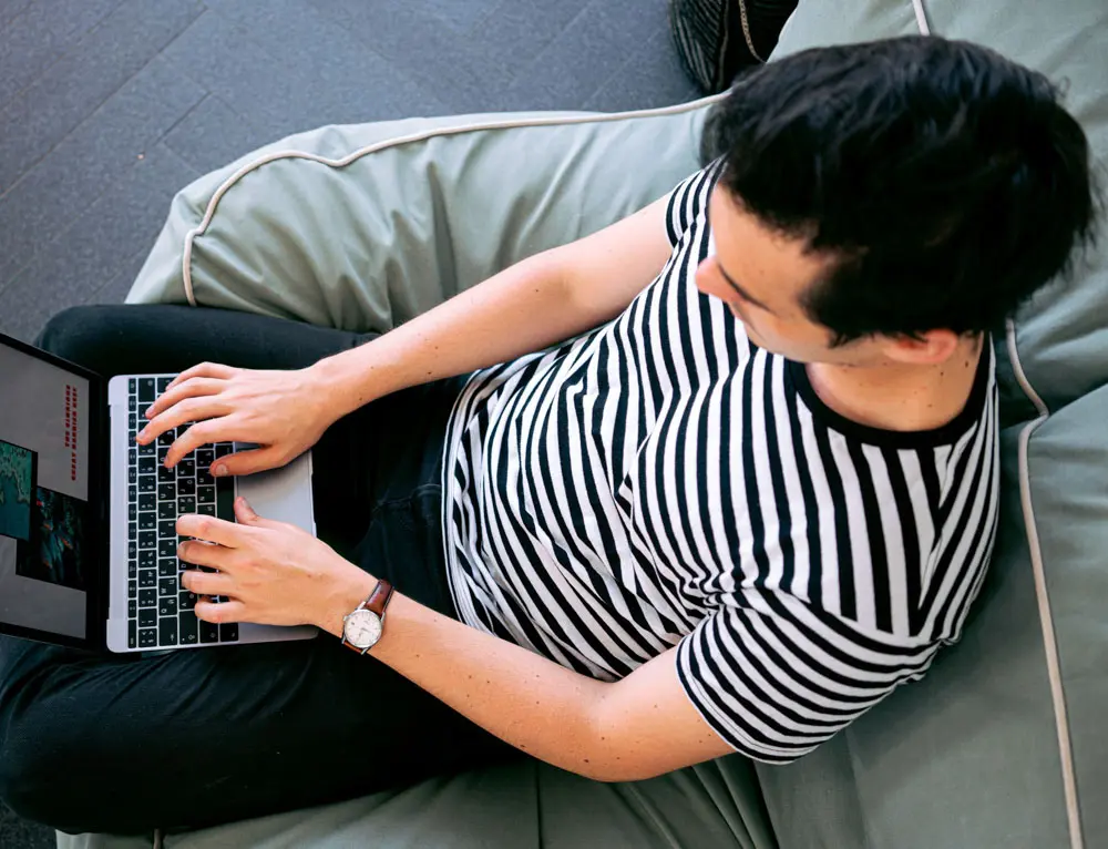 A designer works on laptop.