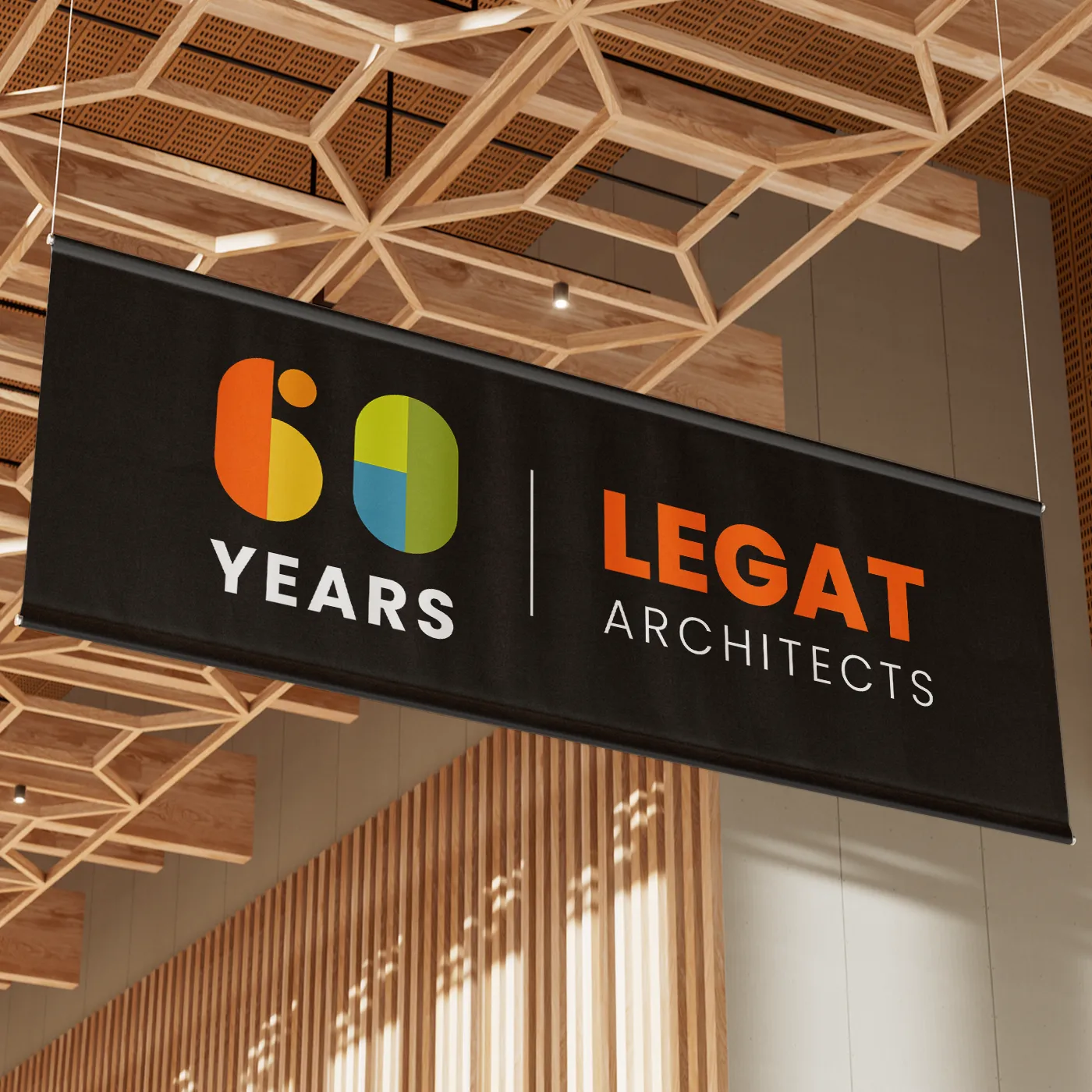 Anniversary logo design for an architects firm celebrating 60 years displayed on a banner.