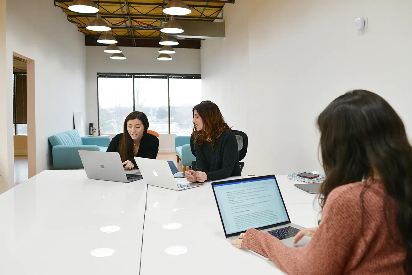 ArtVersion strategy and development team collaborating in the office.